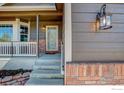 Inviting front porch with brick accents and a stylish entrance. A warm welcome to your new home at 3530 Homestead Dr, Mead, CO 80542