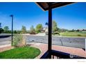 A view from the front porch offers a view of the landscaping, greenery and quiet neighborhood at 3530 Homestead Dr, Mead, CO 80542
