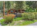 Quaint exterior of the property showcases vibrant foliage and manicured landscaping, enhancing the home's curb appeal at 41 Silver Spruce, Boulder, CO 80302