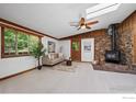 Comfortable living room showcasing wood paneled walls and a cozy seating area at 41 Silver Spruce, Boulder, CO 80302