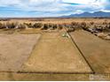 Aerial view of the property land with mountain views and a white tipi at 4963 Kelso Rd, Boulder, CO 80301