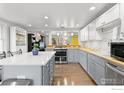 Bright kitchen with stainless steel appliances, wood countertops, and a center island at 6260 W 61St Ave, Arvada, CO 80003