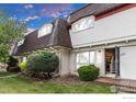 Charming two-story home with landscaped yard and an inviting front entrance at 6328 E Mississippi Ave, Denver, CO 80224