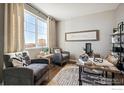 Bright home office featuring wood floors, a large window, comfortable seating and modern decor at 6531 14Th St, Frederick, CO 80530
