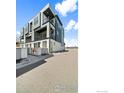 Modern condo building with private balconies showcasing a contemporary architectural design and well-maintained surroundings at 7861 W 51St Ave, Arvada, CO 80002
