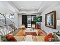 Cozy living room with modern decor, hardwood floors, and stylish furniture at 7861 W 51St Ave, Arvada, CO 80002