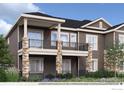 Two-story home with stone accents, multiple balconies, neutral siding, and black metal railings at 903 W 129Th Pl, Westminster, CO 80234