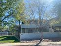 Charming exterior view of the condo with well-maintained landscaping and mature trees at 1117 Elysian Field Dr # B, Lafayette, CO 80026