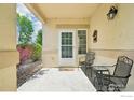 Relaxing front porch featuring outdoor seating, perfect for enjoying the serene neighborhood views at 2420 E 127Th Ave, Thornton, CO 80241