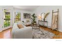 Sun-filled living room with hardwood floors, stylish furniture, and neutral decor at 3515 28Th St # 201, Boulder, CO 80301