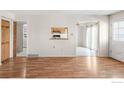 Open-concept living space with wood floors and views to the kitchen and backyard at 3740 Iris Ave # B, Boulder, CO 80301