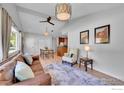 Bright living room and dining area featuring vaulted ceilings and hardwood floors at 714 S Longmont Ave, Lafayette, CO 80026