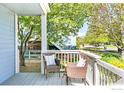Cozy porch with seating, perfect for relaxing outdoors at 725 Arrowood St, Longmont, CO 80503