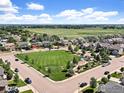 Aerial view of neighborhood showcasing a community green space and Gathering-friendly environment at 920 Wagon Bend Rd, Berthoud, CO 80513