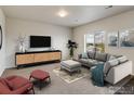 Stylish living room features comfortable seating, a modern entertainment center, and a cozy atmosphere at 920 Wagon Bend Rd, Berthoud, CO 80513