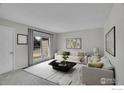 Bright living room showcasing stylish furniture, modern decor, and a large window view at 1201 Stein St, Lafayette, CO 80026