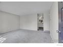 Spacious living room with neutral carpet and ample natural light flowing through the windows at 1201 Stein St, Lafayette, CO 80026