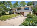 Charming split-level home with a manicured lawn and inviting curb appeal at 1270 Berea Dr, Boulder, CO 80305