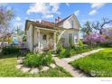 Delightful home with a cute porch, bay window, and inviting pathway lined with lush greenery at 1341 N 95Th St, Lafayette, CO 80026