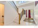 Bright foyer with a modern staircase and a stylish front door at 2485 Lee Hill Dr, Boulder, CO 80302