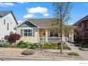 Charming home featuring a covered front porch, complemented by meticulously maintained landscaping and curb appeal at 2827 Twin Lakes Cir, Lafayette, CO 80026