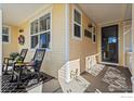 Inviting front porch with comfortable seating, perfect for enjoying the outdoors with stylish outdoor decor at 2827 Twin Lakes Cir, Lafayette, CO 80026