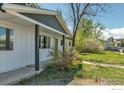 View of the home's entry, porch, and landscaping, situated in a friendly neighborhood at 3100 Denton Ave, Boulder, CO 80303