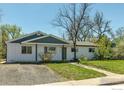 Traditional single-story home with well-maintained landscaping and a welcoming front entrance at 3100 Denton Ave, Boulder, CO 80303