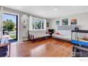 Bright living room with hardwood floors, a large window, and plenty of natural light at 3100 Denton Ave, Boulder, CO 80303