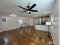 Spacious living room with hardwood floors, seamlessly connecting to a modern kitchen at 3440 W 33Rd Ave, Denver, CO 80211