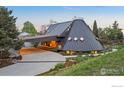 Striking contemporary home with a circular design, unique window accents and inviting driveway at 630 Northstar Ct, Boulder, CO 80304