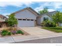 Inviting single-Gathering home with a two-car garage, lush landscaping, and a welcoming driveway at 6721 E 114Th Ave, Thornton, CO 80233