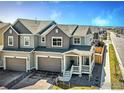 Charming two-story home with a two-car garage and covered front porch at 700 Lillibrook Pl, Erie, CO 80026