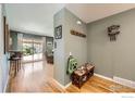Welcoming entryway with wooden floors and a view into the spacious living room at 10723 Loren Ln, Northglenn, CO 80233