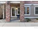 Charming home entrance with brick pillars and well-maintained landscaping in front at 1089 Laramie Blvd, Boulder, CO 80304