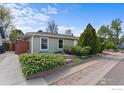 Lovely home with attractive landscaping, featuring lush bushes and well-kept plants at 1650 Bedivere Cir, Lafayette, CO 80026
