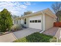 Charming home with an attached garage and well-maintained grounds at 1650 Bedivere Cir, Lafayette, CO 80026