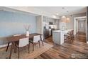 Stylish kitchen with modern appliances, sleek countertops, and a dining area for a comfortable living space at 210 S Cherrywood Dr # 303, Lafayette, CO 80026