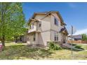 View of the side of a two-story home, highlighting its siding, windows and landscaping at 2104 18Th Ave, Longmont, CO 80501
