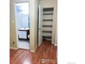 Hallway view with bathroom access and storage closet at 2295 E Asbury Ave # 205, Denver, CO 80210
