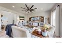 Bright and airy living room with comfortable seating, modern decor, and natural light at 270 Sabin Way, Lochbuie, CO 80603