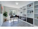 Stylish home office with built-in bookshelves, a large window, and modern desk at 3117 Cimarron Pl, Superior, CO 80027