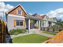 Exterior view showcasing the home's front facade, tidy landscaping, and curb appeal at 3207 N Marion St, Denver, CO 80205