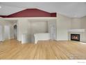 Bright living room featuring a cozy fireplace and gorgeous hardwood floors at 3742 Florentine Cir, Longmont, CO 80503