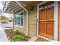 Charming entryway featuring a wood door with glass inset and beautiful garden bed at 3878 Broadway St # 1, Boulder, CO 80304