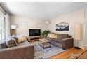Cozy living room boasts hardwood floors, neutral walls, and modern furniture arrangement at 3878 Broadway St # 1, Boulder, CO 80304