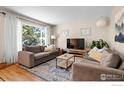 Bright living room with hardwood floors, neutral walls, and plentiful natural light at 3878 Broadway St # 1, Boulder, CO 80304