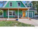Inviting front porch with chairs, plants, and a wood door, perfect for relaxing outdoors at 485 Grape Ave, Boulder, CO 80304