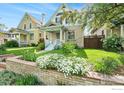 Well-kept two-story home with brick accents and a landscaped front yard at 486 N Corona St, Denver, CO 80218