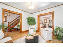 Inviting living room featuring hardwood floors and natural wood trim at 486 N Corona St, Denver, CO 80218